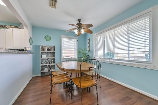 4606 Jamaica Cove Rd, Jamaica Beach, TX 77554 - dining space with a ceiling fan, baseboards, and wood finished floors