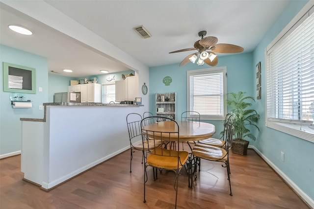 4606 Jamaica Cove Rd, Jamaica Beach, TX 77554 - dining room with a ceiling fan, plenty of natural light, wood finished floors, baseboards, and recessed lighting