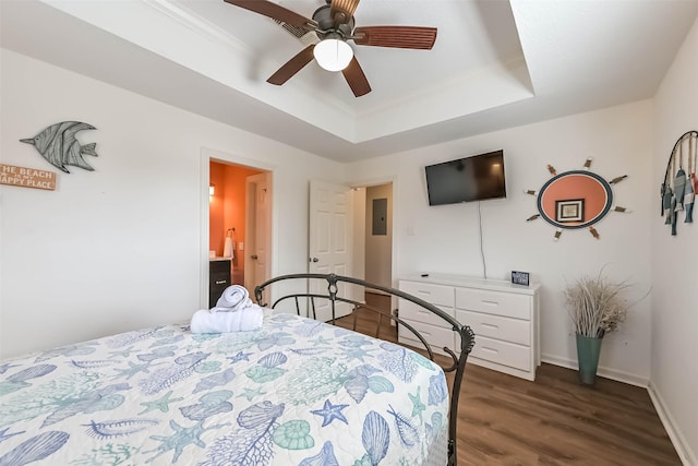4606 Jamaica Cove Rd, Jamaica Beach, TX 77554 - bedroom featuring dark wood-type flooring, ornamental molding, a tray ceiling, baseboards, and ceiling fan