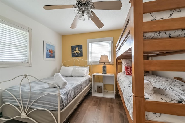 4606 Jamaica Cove Rd, Jamaica Beach, TX 77554 - bedroom featuring wood finished floors and a ceiling fan