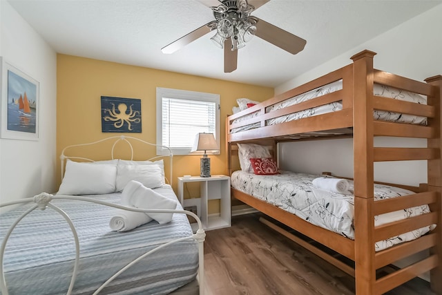 4606 Jamaica Cove Rd, Jamaica Beach, TX 77554 - bedroom with wood finished floors and ceiling fan