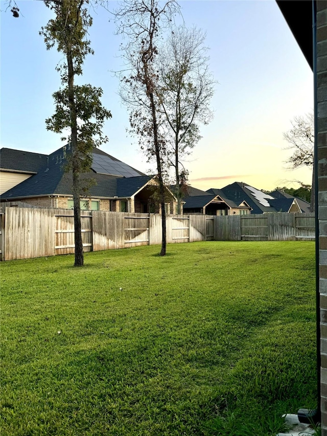 1215 Tallow Park Ln, Pinehurst, TX 77362 - view of yard at dusk