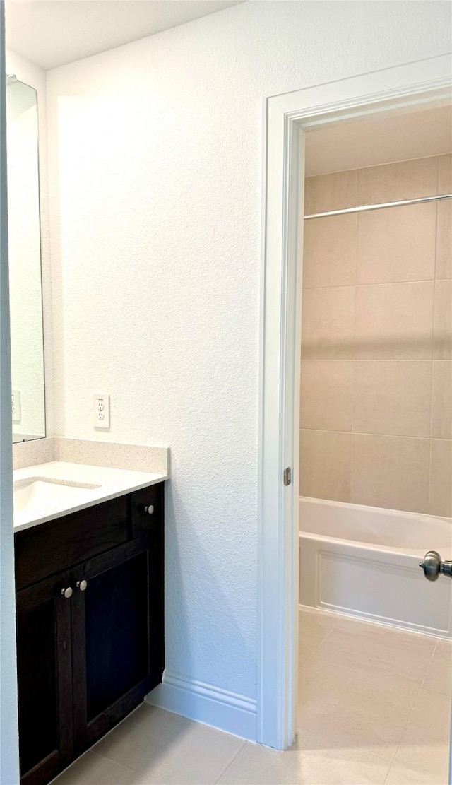 1215 Tallow Park Ln, Pinehurst, TX 77362 - full bathroom with vanity, tub / shower combination, tile patterned floors, and baseboards