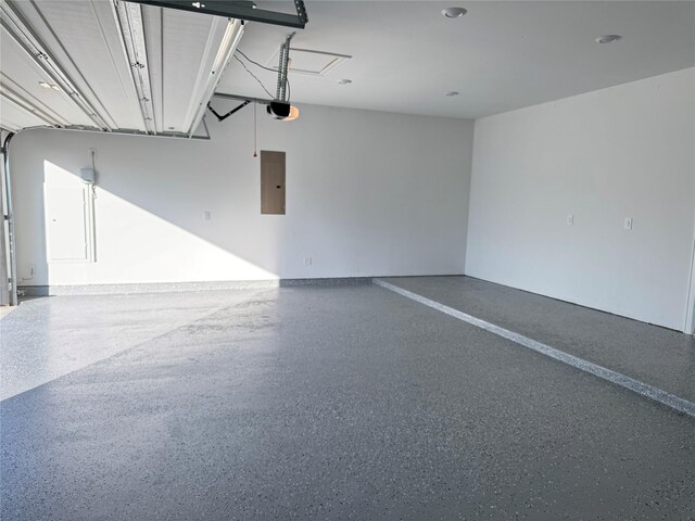 1215 Tallow Park Ln, Pinehurst, TX 77362 - garage featuring electric panel and a garage door opener