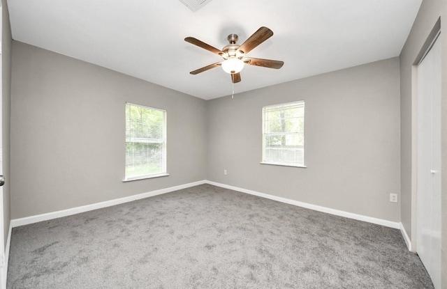 720 Roosevelt St, La Marque, TX 77568 - empty room featuring carpet flooring, plenty of natural light, and a ceiling fan