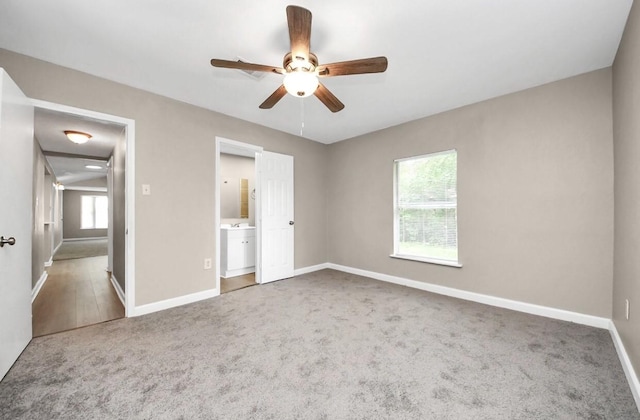 720 Roosevelt St, La Marque, TX 77568 - unfurnished bedroom with carpet flooring, baseboards, ensuite bathroom, and ceiling fan