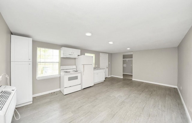 720 Roosevelt St, La Marque, TX 77568 - kitchen with white appliances, white cabinetry, under cabinet range hood, baseboards, and recessed lighting