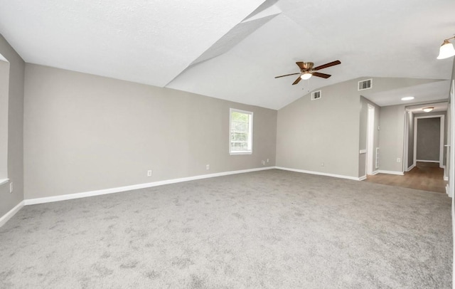 720 Roosevelt St, La Marque, TX 77568 - unfurnished room featuring carpet flooring, ceiling fan, lofted ceiling, and baseboards