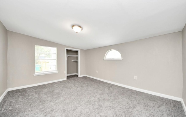 720 Roosevelt St, La Marque, TX 77568 - unfurnished bedroom featuring carpet flooring, a closet, baseboards, and lofted ceiling