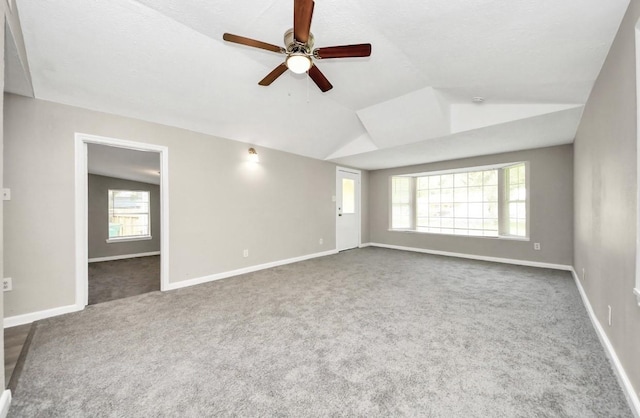 720 Roosevelt St, La Marque, TX 77568 - carpeted spare room with a ceiling fan, vaulted ceiling, and baseboards