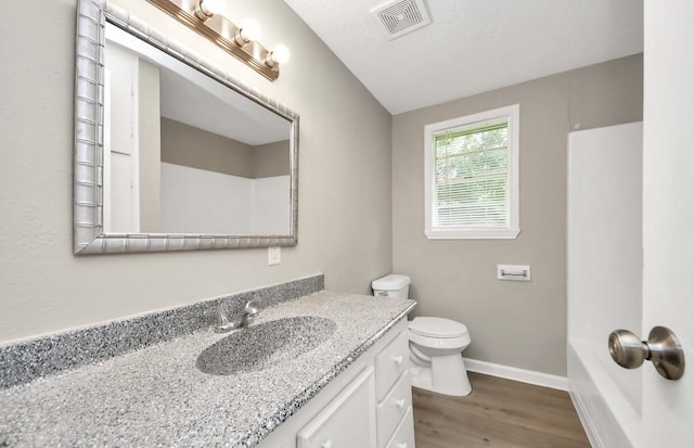 720 Roosevelt St, La Marque, TX 77568 - full bath with wood finished floors, vanity, toilet, and baseboards
