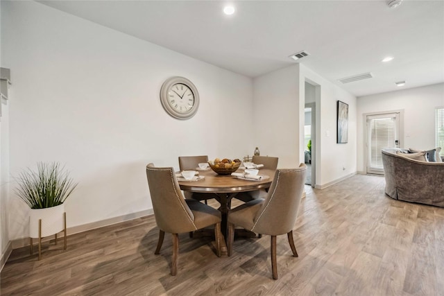 14714 Sweet Water Dr, Baytown, TX 77523 - dining space with light wood-type flooring, baseboards, and recessed lighting