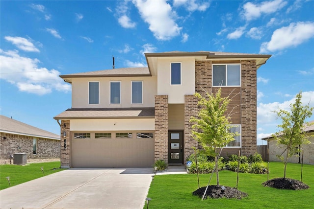 14714 Sweet Water Dr, Baytown, TX 77523 - view of front facade with central air condition unit, a garage, concrete driveway, and a front yard