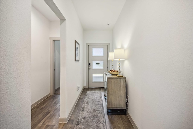 14714 Sweet Water Dr, Baytown, TX 77523 - doorway to outside featuring dark wood-style floors and baseboards