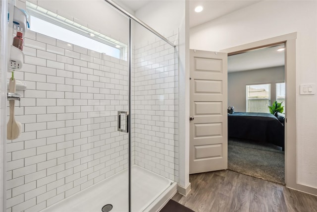 14714 Sweet Water Dr, Baytown, TX 77523 - ensuite bathroom featuring wood finished floors, a stall shower, and recessed lighting