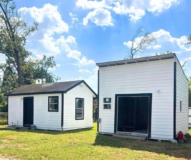 7609 Shotwell St, Houston, TX 77016 - back of property with an outdoor structure and a yard
