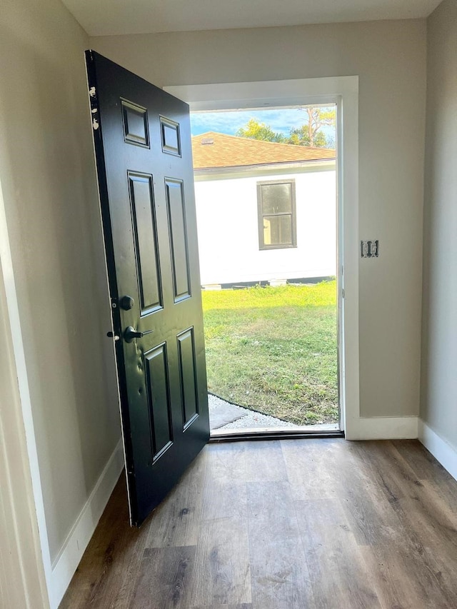 7609 Shotwell St, Houston, TX 77016 - entryway featuring wood finished floors, baseboards, and healthy amount of natural light