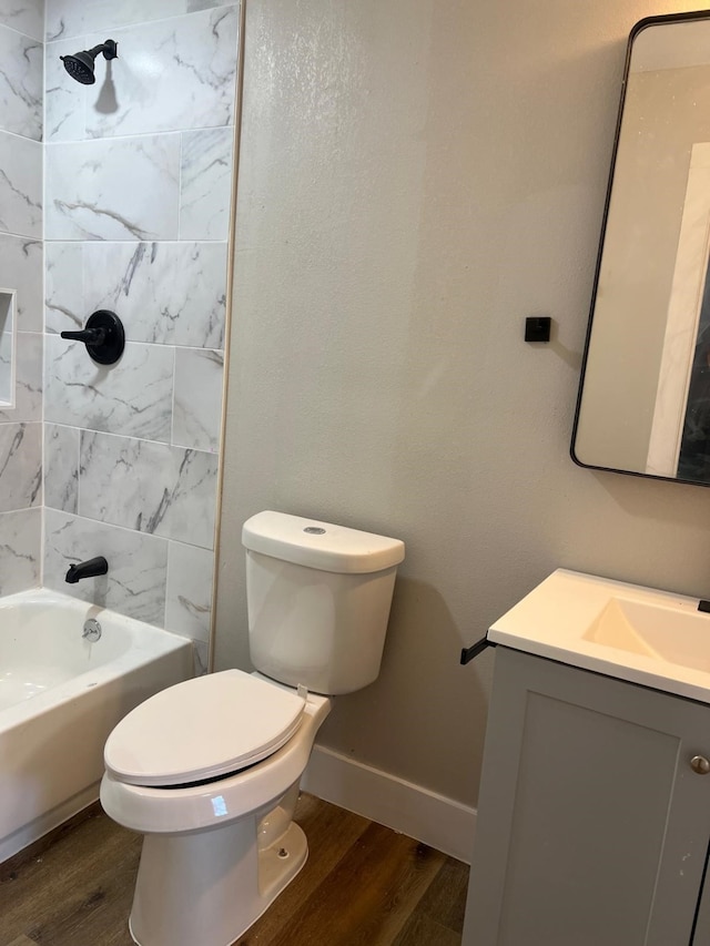 7609 Shotwell St, Houston, TX 77016 - bathroom featuring wood finished floors, toilet, vanity, and baseboards