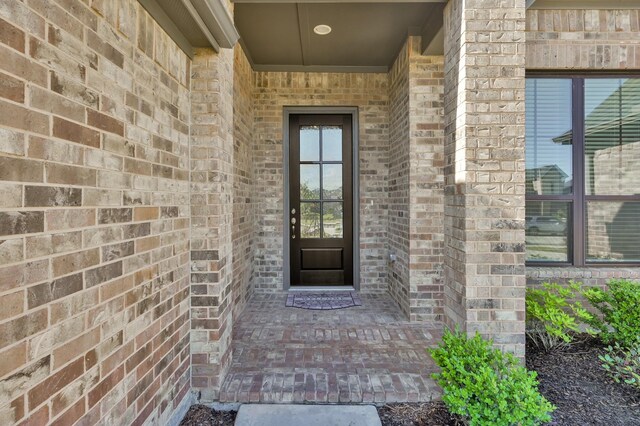 10066 Preserve Way, Conroe, TX 77385 - doorway to property featuring brick siding