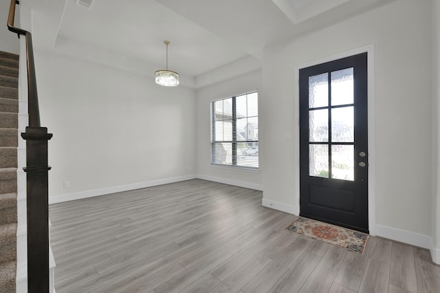 10066 Preserve Way, Conroe, TX 77385 - entryway with stairway, wood finished floors, a raised ceiling, and baseboards