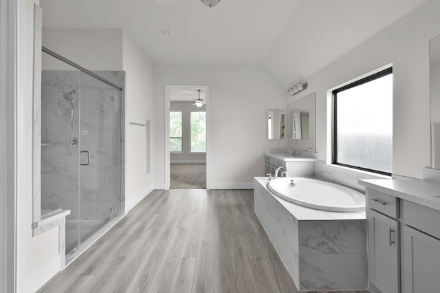 10066 Preserve Way, Conroe, TX 77385 - full bath with a marble finish shower, a garden tub, a ceiling fan, vanity, and lofted ceiling