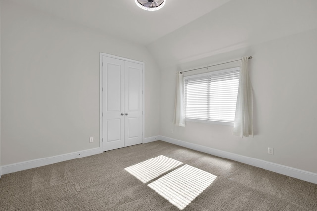 10066 Preserve Way, Conroe, TX 77385 - spare room with carpet flooring, baseboards, and vaulted ceiling