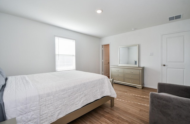 9315 Sierra Point Way, Baytown, TX 77521 - bedroom featuring wood finished floors, baseboards, and recessed lighting