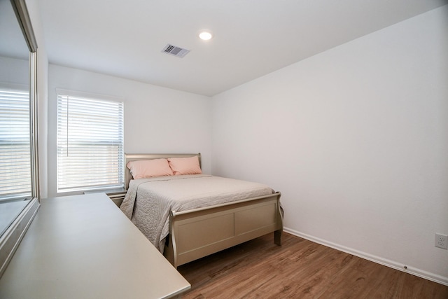 9315 Sierra Point Way, Baytown, TX 77521 - bedroom with wood finished floors, baseboards, and recessed lighting