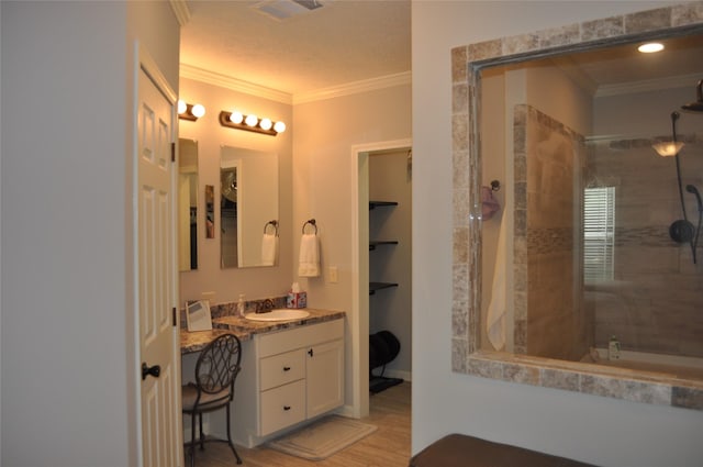 280 Lakewood Cir, Brenham, TX 77833 - bathroom with a stall shower, crown molding, wood finished floors, and vanity