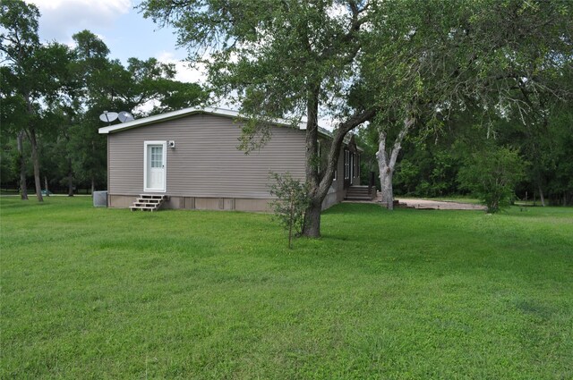 280 Lakewood Cir, Brenham, TX 77833 - view of green lawn with entry steps