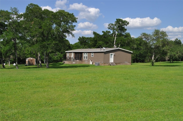 280 Lakewood Cir, Brenham, TX 77833 - view of green lawn featuring a storage shed and an outbuilding