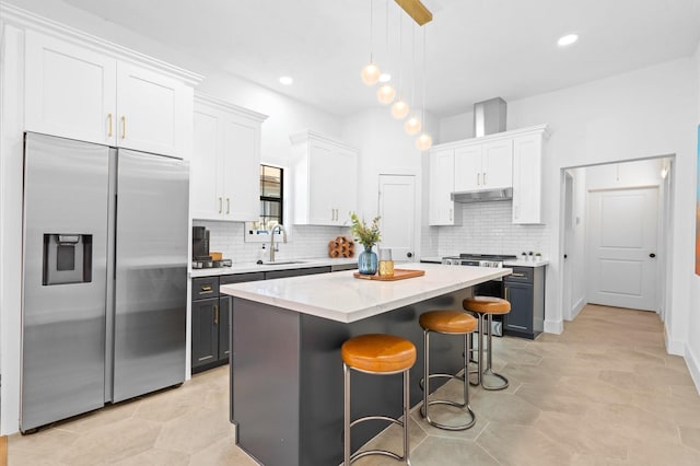 128 N Jenkins St, Houston, TX 77003 - kitchen with stainless steel built in fridge, a sink, a center island, tasteful backsplash, and recessed lighting
