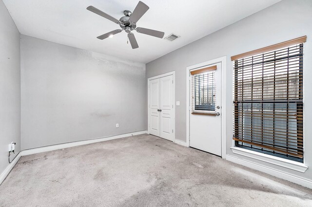 2503 Dallas St, Houston, TX 77003 - unfurnished bedroom with carpet, baseboards, ceiling fan, and a closet