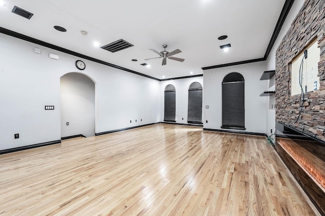 2503 Dallas St, Houston, TX 77003 - unfurnished living room featuring crown molding, ceiling fan, arched walkways, light wood-type flooring, and recessed lighting