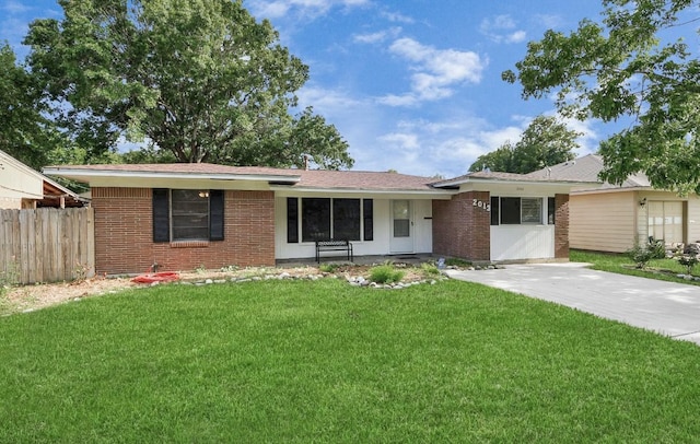 2013 15th Ave N, Texas City, TX 77590 - ranch-style house with brick siding, a porch, and driveway