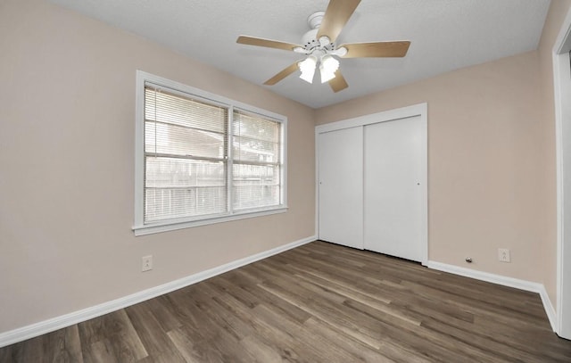 2013 15th Ave N, Texas City, TX 77590 - unfurnished bedroom with baseboards, a closet, and wood finished floors