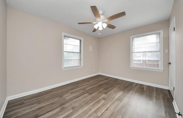 2013 15th Ave N, Texas City, TX 77590 - spare room featuring wood finished floors, baseboards, and ceiling fan