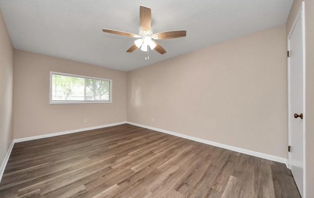 2013 15th Ave N, Texas City, TX 77590 - unfurnished room with a ceiling fan, wood finished floors, and baseboards