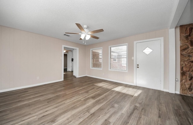2013 15th Ave N, Texas City, TX 77590 - foyer with a ceiling fan, a textured ceiling, wood finished floors, and baseboards