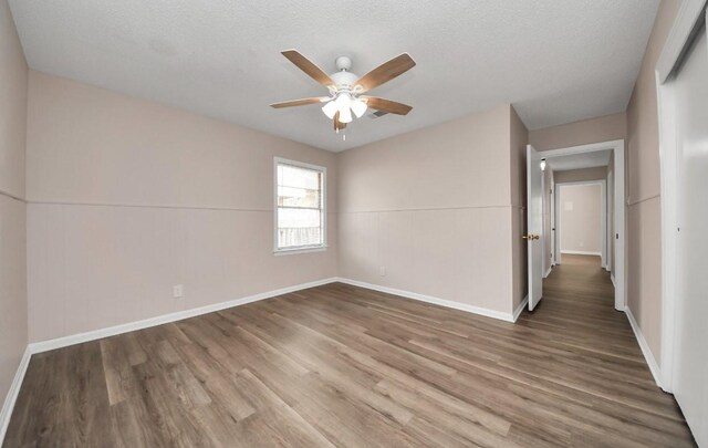 2013 15th Ave N, Texas City, TX 77590 - spare room with a ceiling fan, wood finished floors, and baseboards