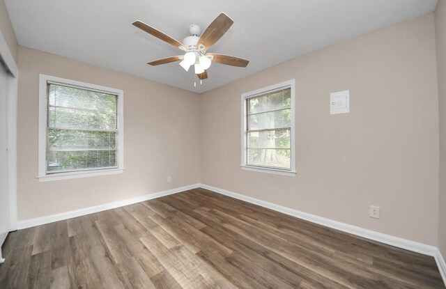 2013 15th Ave N, Texas City, TX 77590 - spare room with plenty of natural light, a ceiling fan, and baseboards