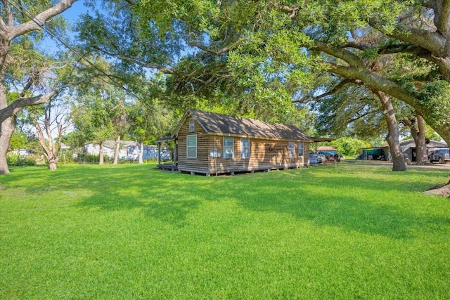 3929 Almeda Genoa Rd, Houston, TX 77047 - view of grassy yard with an outbuilding