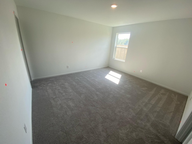 464 Shoreview Dr, Conroe, TX 77303 - spare room featuring dark carpet and baseboards