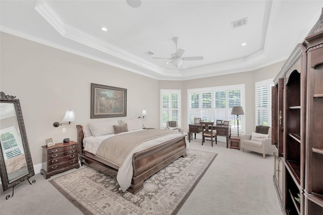 bedroom with a raised ceiling, light carpet, ornamental molding, ceiling fan, and recessed lighting