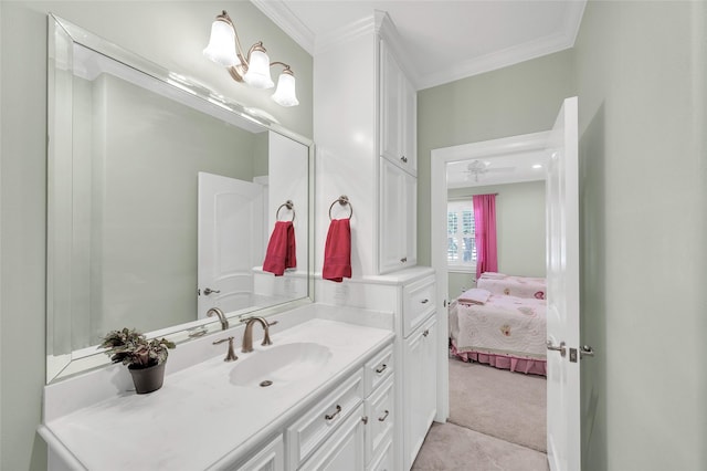 ensuite bathroom featuring crown molding and vanity