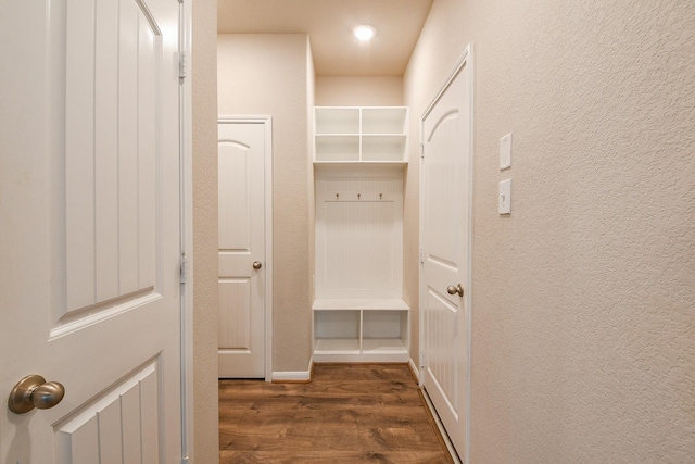 14923 Cutleaf Ln, Cypress, TX 77429 - mudroom featuring wood finished floors and a textured wall