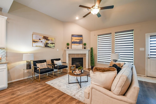14923 Cutleaf Ln, Cypress, TX 77429 - living area with a ceiling fan, lofted ceiling, wood finished floors, and a fireplace