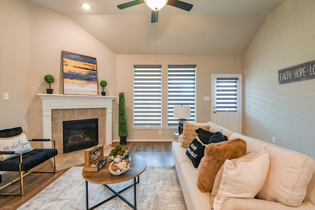 14923 Cutleaf Ln, Cypress, TX 77429 - living area with lofted ceiling, wood finished floors, ceiling fan, and a tile fireplace