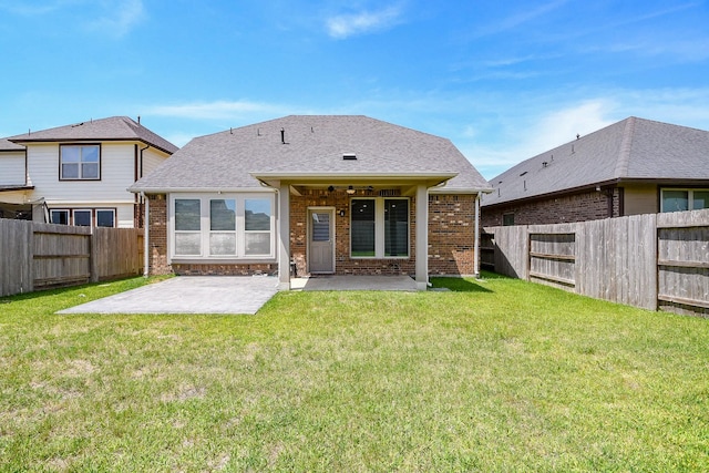 14923 Cutleaf Ln, Cypress, TX 77429 - back of house with a patio area, brick siding, a fenced backyard, and roof with shingles