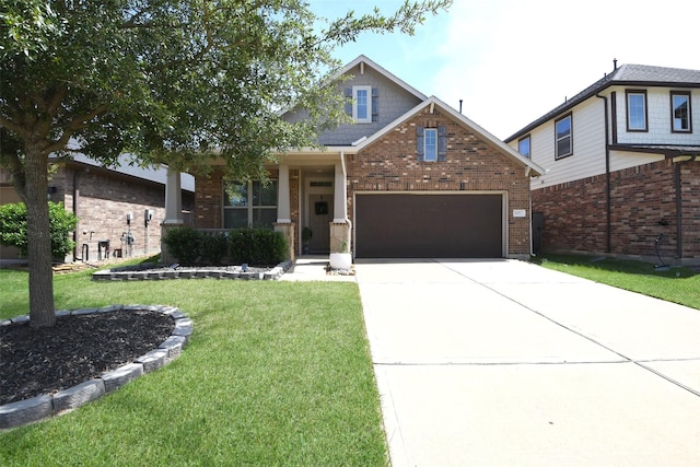 14923 Cutleaf Ln, Cypress, TX 77429 - view of front of home featuring a front yard, an attached garage, brick siding, and driveway